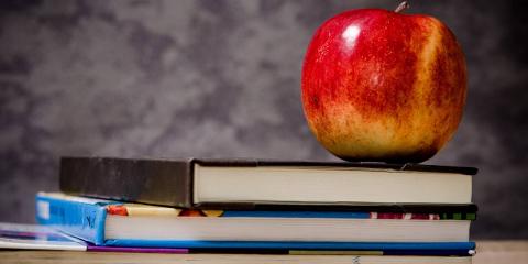 Back to school - apple on top of books
