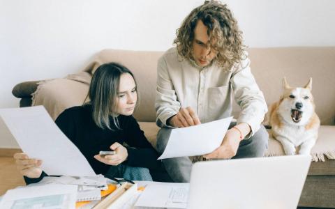 Man and woman discussing finances at home